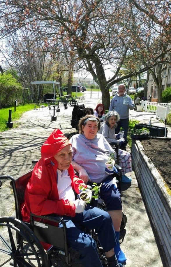 Suffolk Center residents enjoy planting on Earth Day 2022.